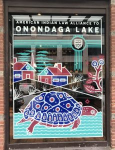 Patagonia window art in support of Onondaga Lake