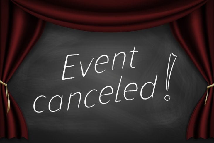 Event Cancelled written on a chalkboard surrounded by a banner